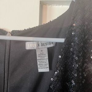 Black sequin tulip hem dress.